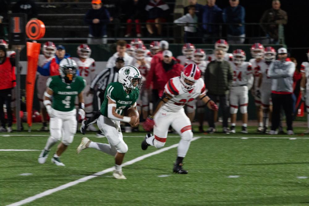 Junior quarterback Nikko Morris takes it himself early in the first quarter.