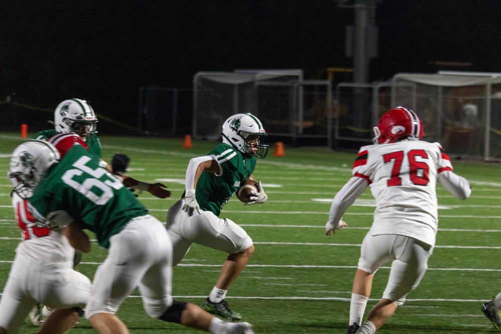 Junior running back Louie Freitas takes the handoff and jets to the outside for what would be the Indians first touchdown of the game.