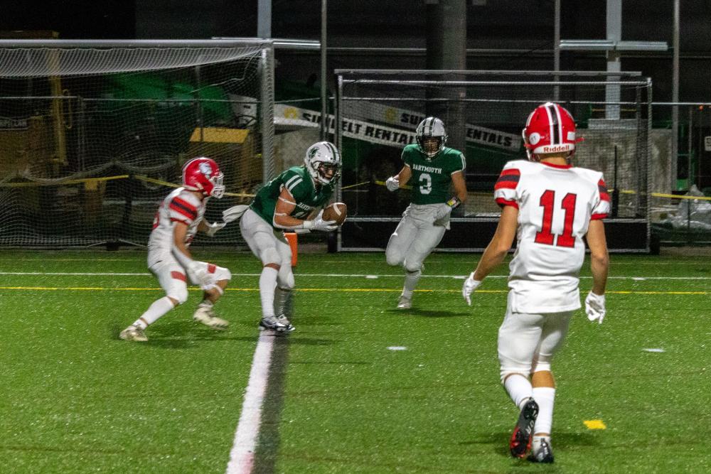 Senior wide receiver Graham White pulls in a miraculous tipped hail mary pass as time expires in the second half.