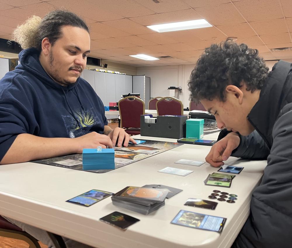 Glinski double checks the fine print on a card.