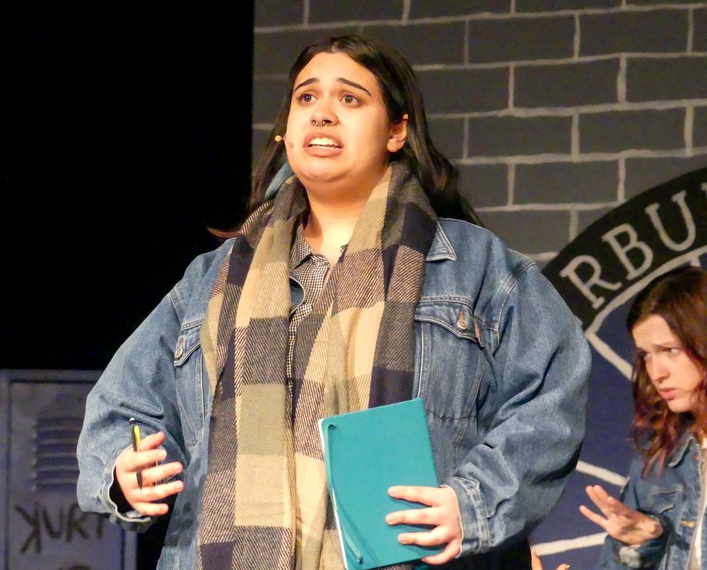 Sara Cravo, as “Veronica Sawyer,” performing the song “Beautiful.”