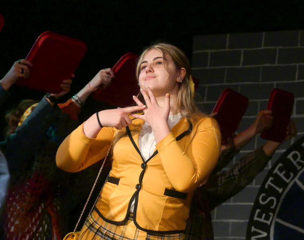 Emerson DiSalle, as “Heather Mcnamara,” as she is introduced on stage.