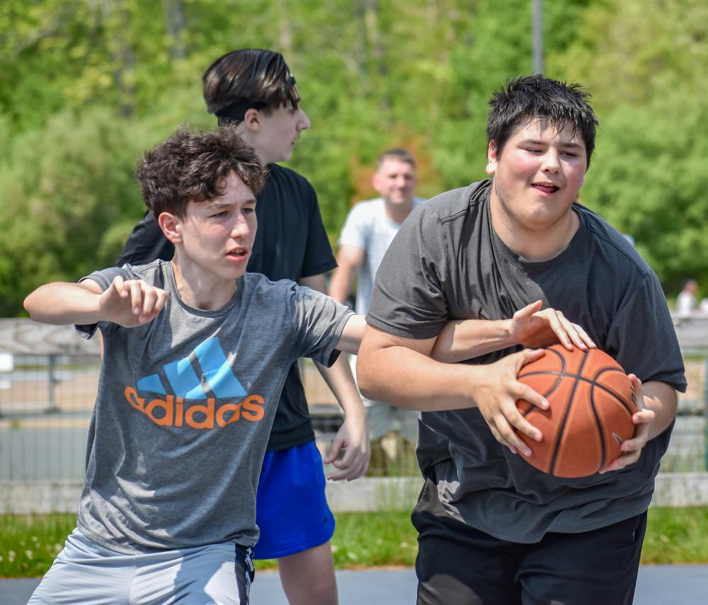 Seth Sullivan works to get away from Koen Crowell during the game.