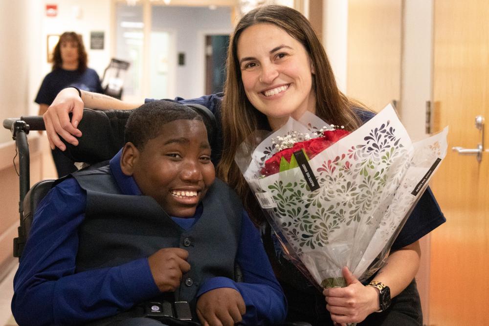 Schwartz School student Cherubin Mbenza gifted flowers to Teacher Assistant Caterina Freitas at the school’s starry night prom on Thursday, May 16. Photos by Sawyer Smook-Pollitt