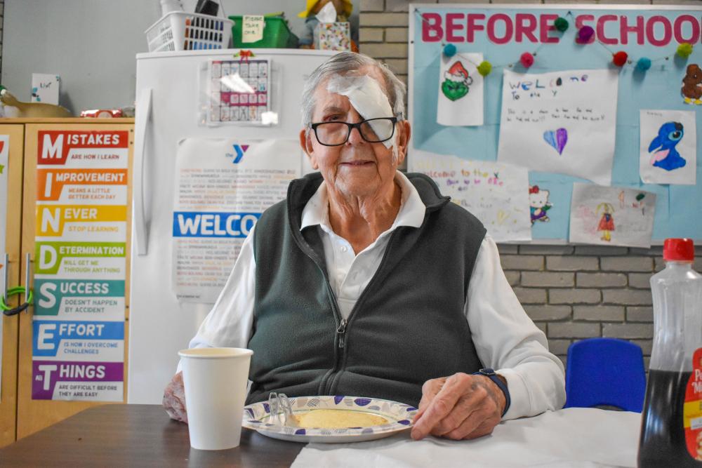 Arthur Huguley enjoys the pancake breakfast he earned for visiting the YMCA 244 times in one year. Photos by Leighah Beausoleil