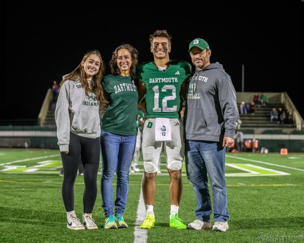 Jackson Hart with his family on Memorial Stadium Field. Source: Jackson Hart