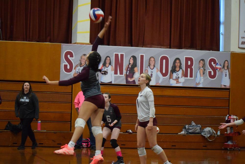 Savannah Morris reaches for the ball. vball