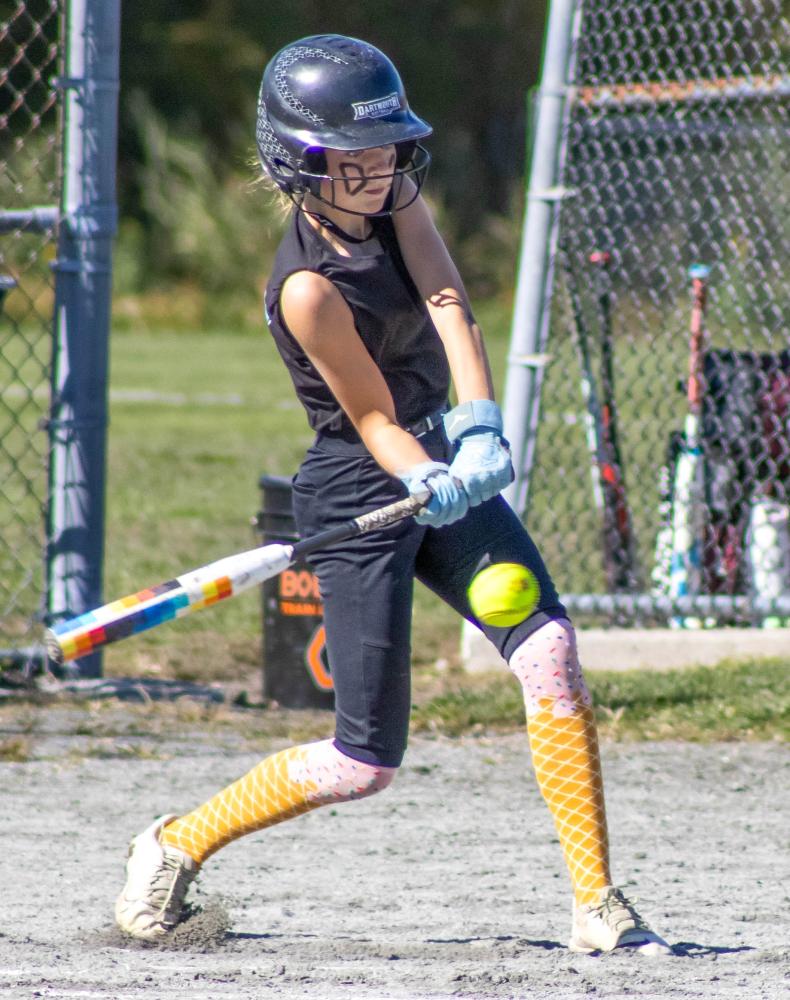 Alivia Wenson swings the bat. s