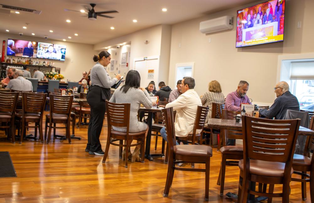 Customers come to Novo Mundo for lunch. inside restaurant