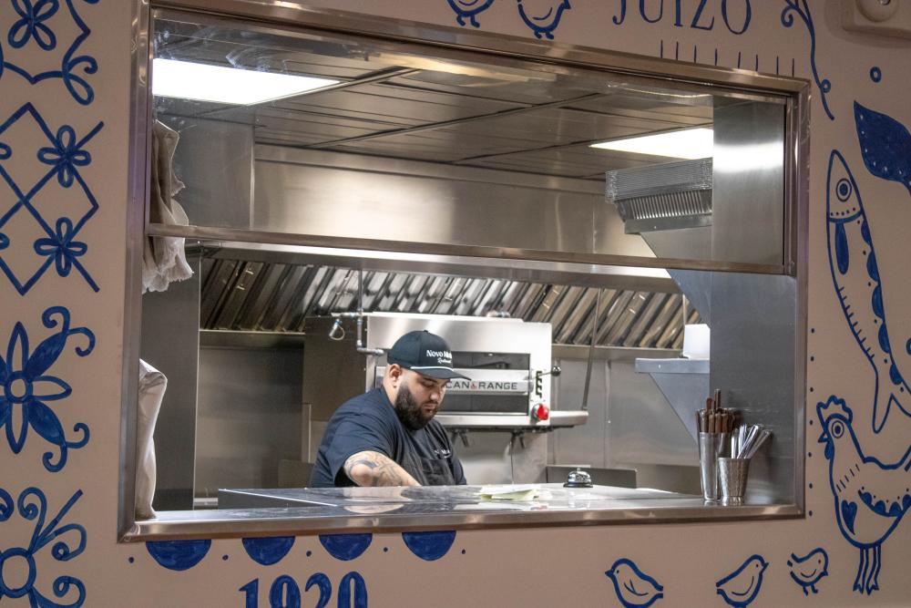 Jonathon Amaral works in the kitchen. Jonathon Amaral
