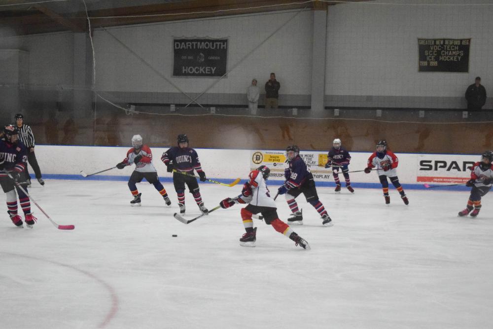 Landon Amaral shoots the puck toward the goal. Photos by Kat Sheridan Landon Amaral shoots the puck toward the goal. Photos by Kat Sheridan