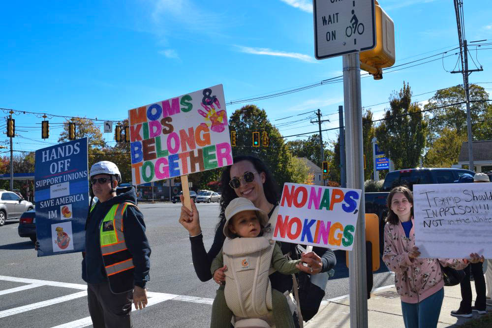 A mother and her child protest together. A mother and her child protest together.