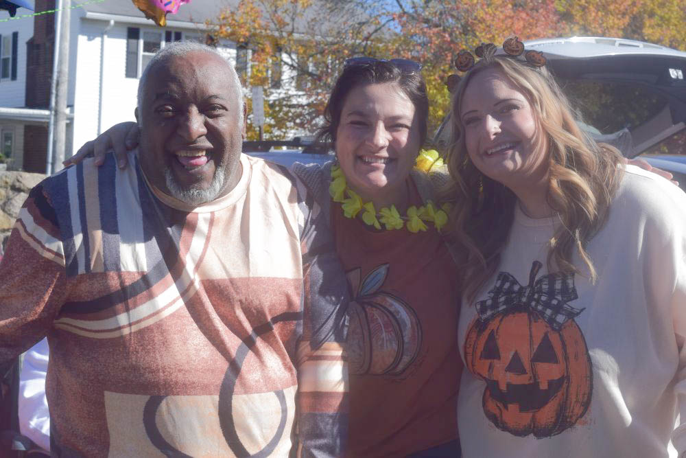 Manny Pires, Olivia Lourenco and Brittney Lawrence volunteer at the trunk-or-treating.  Manny Pires, Olivia Lourenco and Brittney Lawrence volunteer at the trunk-or-treating.