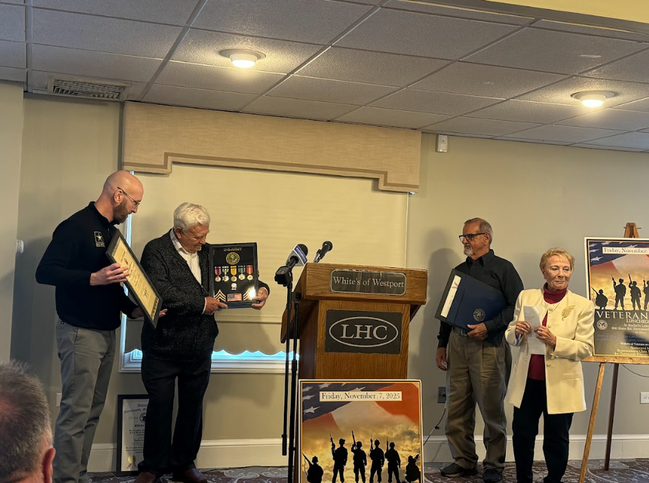 Robert Mayo receives a set of pins from Matthew Briouillette of the Veteran's Service Board. Photos by Kat Sheridan