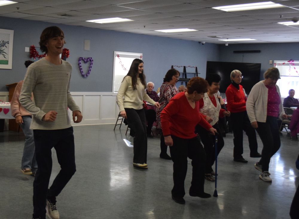 Students and members of the Council on Aging dance together. Photos by Kat Sheridan