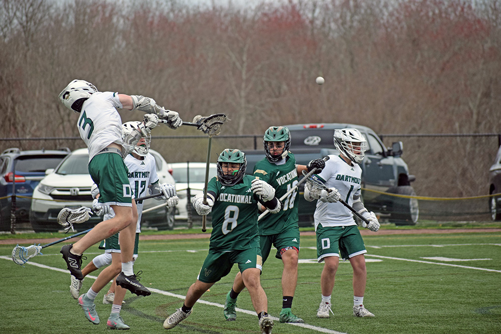 Jack Howarth jumps to pass the ball. Photos by Kat Sheridan