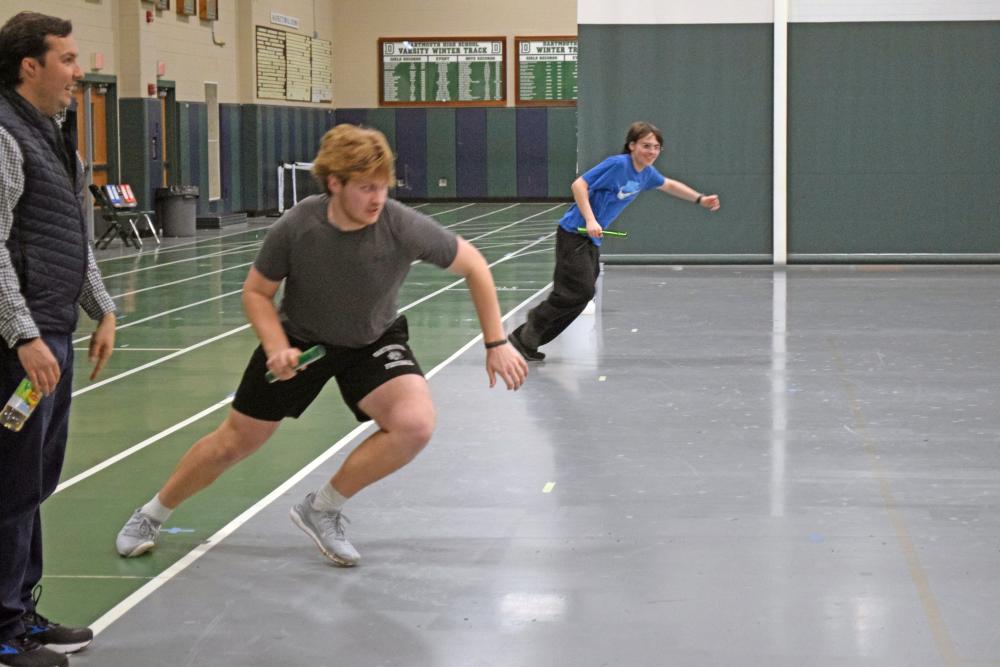 Coach John Breault watches Aidan Gendron race Jason Sullivan. Photos by Kat Sheridan