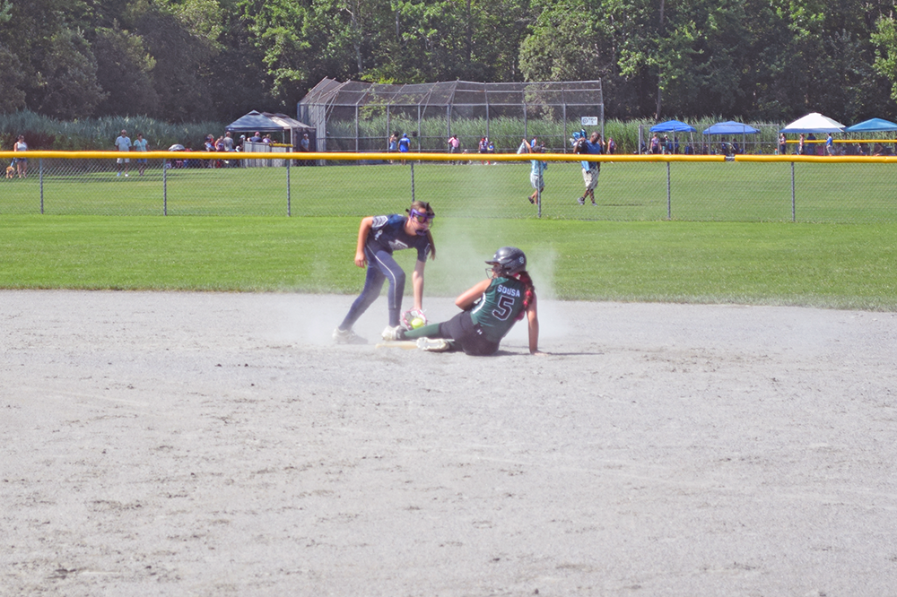A player slides to base. Photos by Kat Sheridan