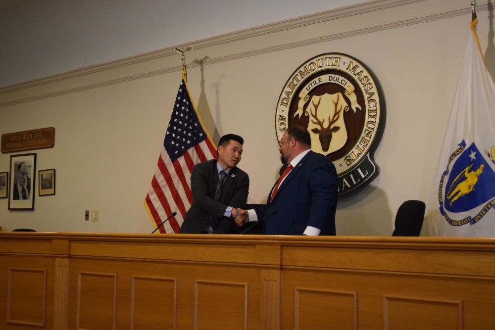 Chester Tam and Henry Bousquet shake hands at the end of the debate. Photos by Kat Sheridan