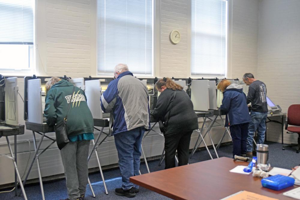 Residents vote at Town Hall. Photo by Kat Sheridan