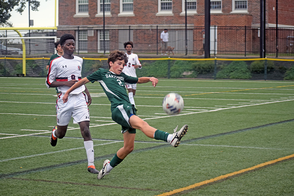 Casey Martinho keeps the ball from going out of bounds. Photos by Kat Sheridan