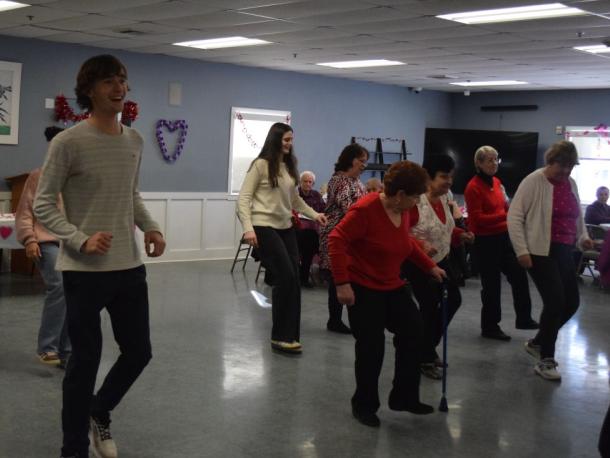Students and members of the Council on Aging dance together. Photos by Kat Sheridan