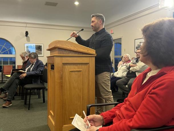 Principal engineer Christian Farland speaks at the Zoning Board of Appeals meeting. Photo by Kat Sheridan