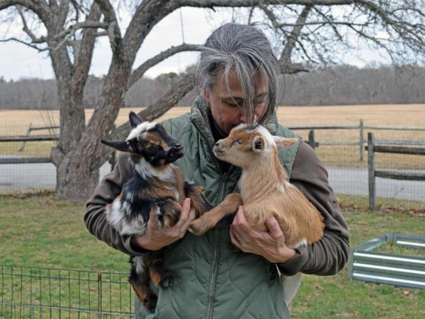 Shannon Lawrence snuggles with the baby goats. Photos by Kat Sheridan