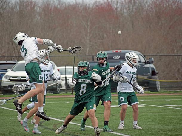 Jack Howarth jumps to pass the ball. Photos by Kat Sheridan