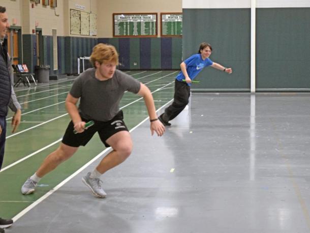 Coach John Breault watches Aidan Gendron race Jason Sullivan. Photos by Kat Sheridan