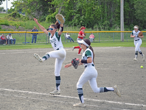 Emma Silva celebrate the end of an inning. Photos by Kat Sheridan