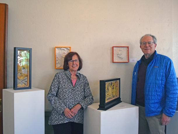 Susan Medyn and David Formanek pose in front of some of their art. Photos by Kat Sheridan