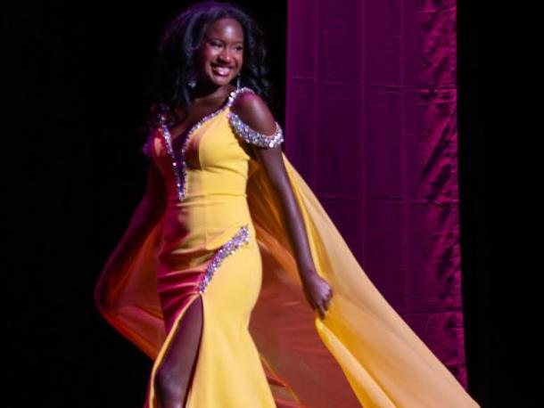 Kercheena Pamphile wears a yellow gown that represents her personality. Photos by Steve Smith Photography