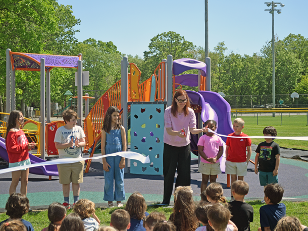 Audra Thomas cuts the ribbon with (right to left) Lenox Porta from kindergarten, Zoe Francis from first grade, Josie Oliver from second grade, Lillian Cabral from third grade, Atticus Folger from fourth grade and Mila DeBarros from fifth grade. Photos by Kat Sheridan.