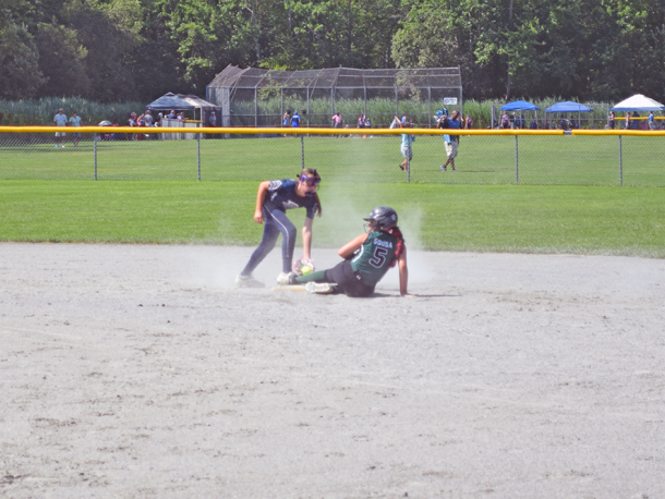 A player slides to base. Photos by Kat Sheridan