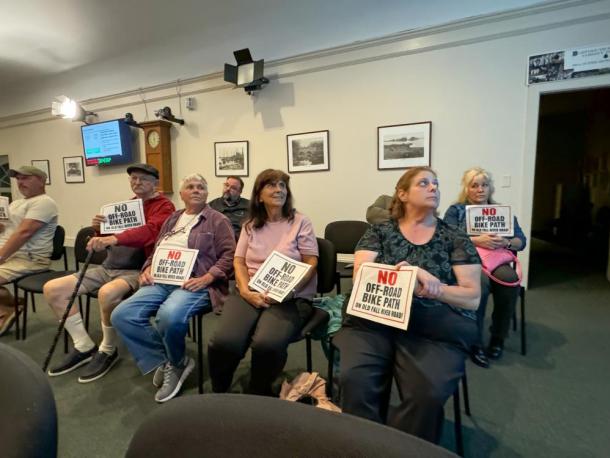 Residents with their signs. Photo by Kat Sheridan