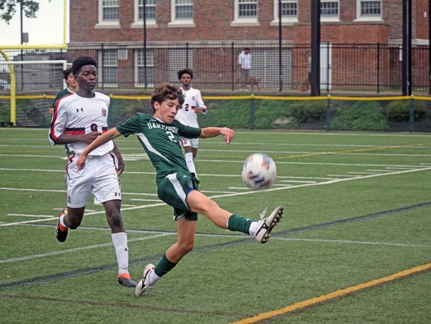 Casey Martinho keeps the ball from going out of bounds. Photos by Kat Sheridan