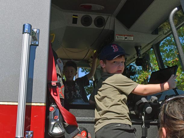 Two kids explore the fire truck. Photos by Kat Sheridan