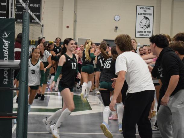 The students run past their friends for high fives. Photos by Kat Sheridan