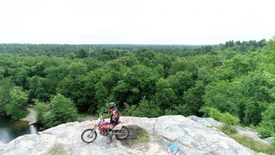 A dirtbike rider poses atop a rock formation at Freetown-Fall River State Forest. COURTESY ANTHONY FRANCO