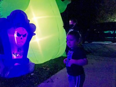 Grayson contemplates an inflatable gravestone.