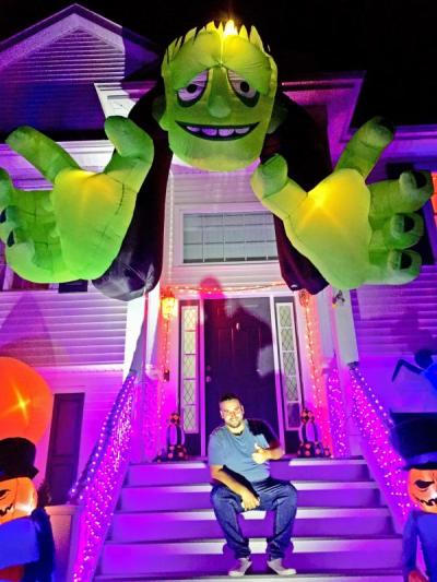 Jordan Paiva in front of his house on Cotton Candy Lane.