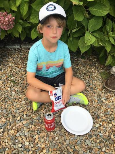 Michael Reimels, 9, digs into his potato chips.