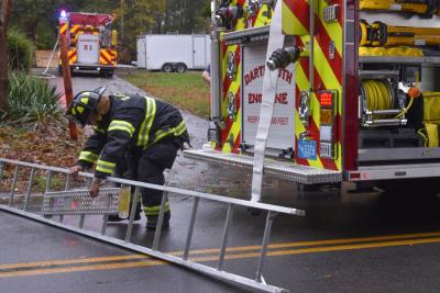 A District No. 2 firefighter prepares a ladder. Dartmouth Week - Dartmouth, MA news