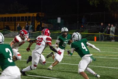 Sophomore running back Ray Gramlich bounces a run to the outside.