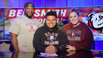 Ben Smith and his family in their Dean College regalia. Photo by Ross Thibault