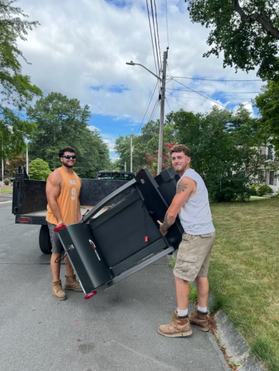 Jared Holmes and Jared burns moving items at a job.