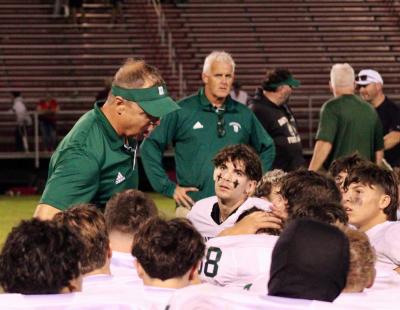 Head coach Richard White talks to the team after their win. Photos by Brandy Muz 