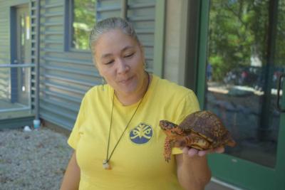 Amanda Nowicka shows off a local turtle. 