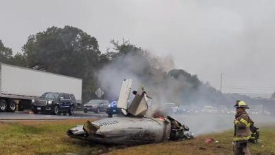 The plane emits smoke while on fire on Monday, Oct. 13. Source: wtf_accidents Instagram page wtf fire